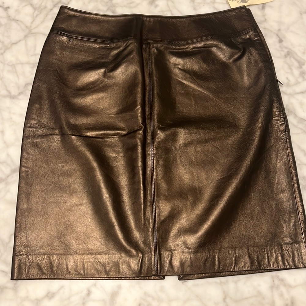 Women’s bronze leather skirt-Fully lined small zippered pocket front right. Sz 8